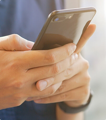 closeup of hands holding a smart phone